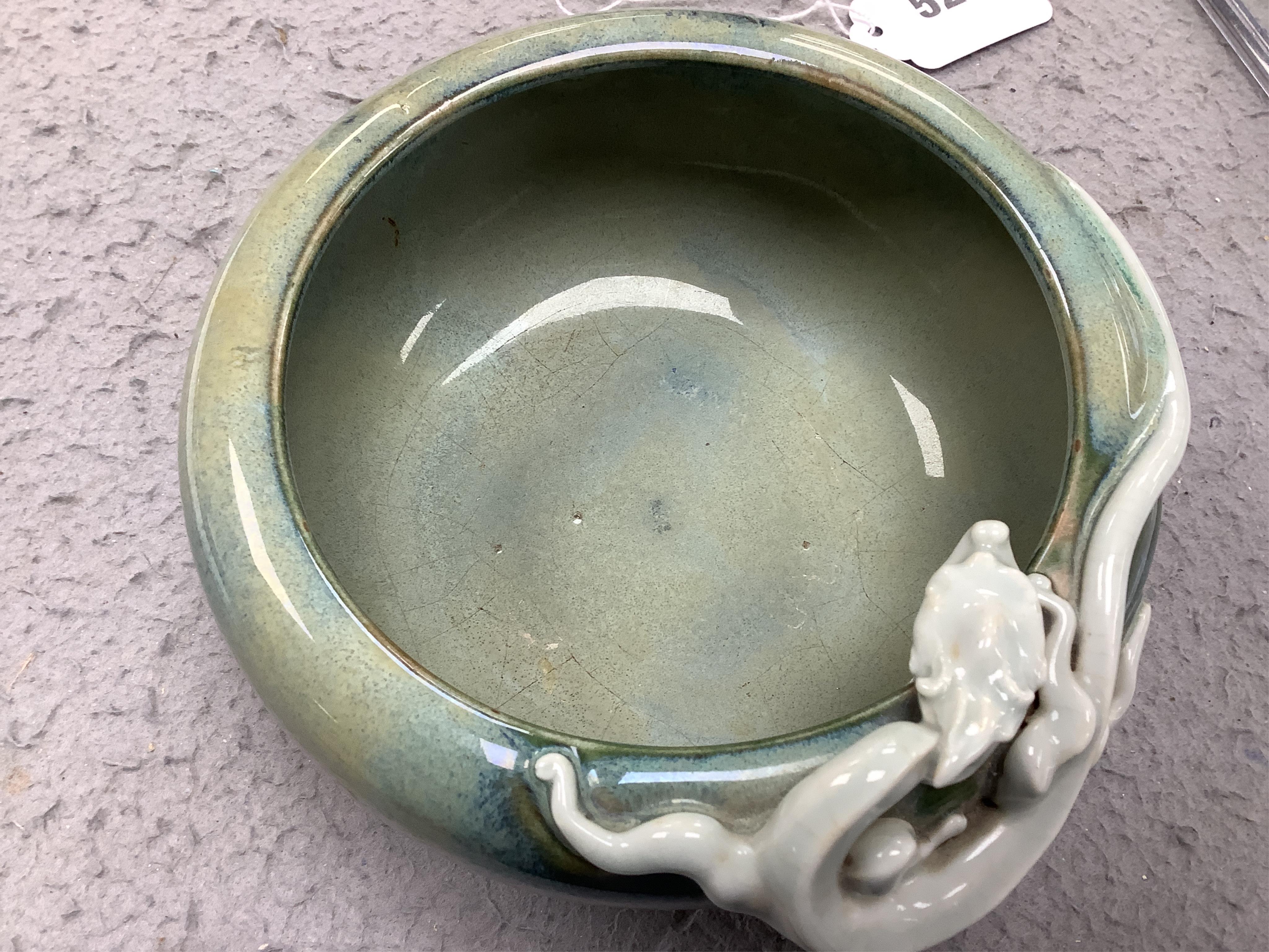 A Japanese Sumidagawa ware ‘dragon’ bowl, Meiji period, signed Ishiguro Koko, wood stand. Condition - scratching and crazing to the glaze on the interior otherwise good.